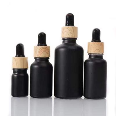 China Custom Black 100Ml 50Ml 30Ml Cosmetic Wholesale Empty Bottle Glass Dropper Essential Oil Bottles Supplier With Screw Lid for sale