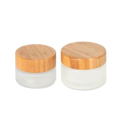 China 30G 50G 100G Bamboo Oil Lids Glass Empty Wooden Lids Cosmetic Slanted Shoulder Lotion Jar Glass Jar for sale