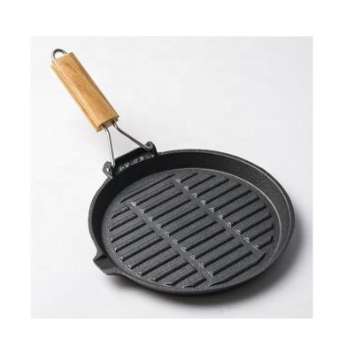 China Sustainable Flat Bottom Griddle Grill Pan Cast Iron 24cm With Foldable Wooden Handle for sale