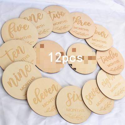 China 12pcs Natural Wooden Monthly Milestone Circles 1-12 Months Name Birth Card Circles For Monthly Baby Photographs for sale