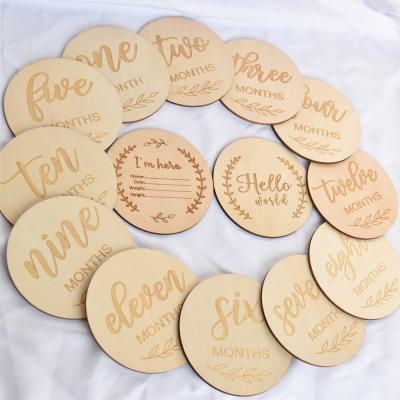 China 14pcs Natural Wood Disc Baby Plaque Hello World Engraved Milestone For Baby Gift for sale