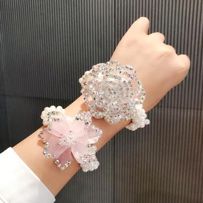 China Beautiful Flower 2021 Hot Selling Popular Amazon Women Girl Wedding Pearl New Crystal Elastic Hair Band for sale