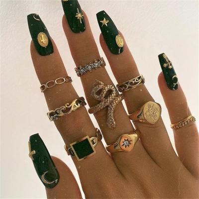 China Designs Bohemia Oil Jewelry Personality Trend Creative Drip Hollow Snake Shaped Diamond 9 Piece Set Ring for sale