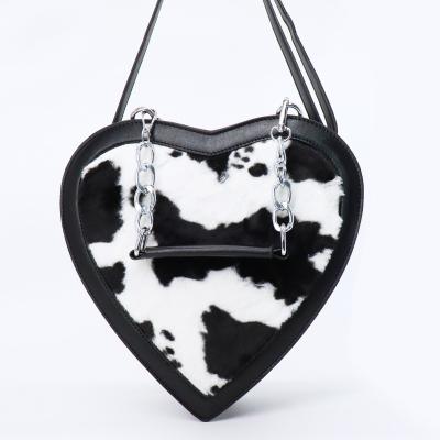 China PORTABLE Bag Cow Printing Factory Customized Faux Fur Clips Heart Shape Ladies Plush Handbag With Chain Handle PU Leather Backpack for sale