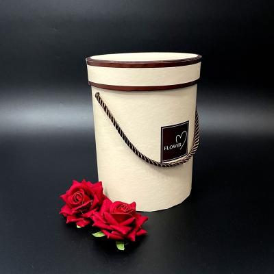 China Hand Rope Round Tube Paper Flower Box Recyclable Gift Packaging Round Tube Paper Box Package Box Fashion Luxury Paper Vouchers Price For Flower for sale