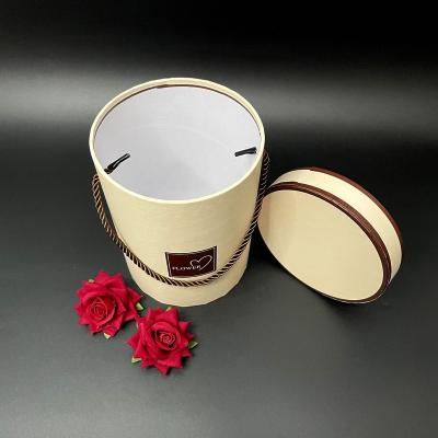 China Manufacturer Recyclable Wholesale Cylinder Kraft Paper Gift Tube Packing Luxury Round Gift Boxes Tube Paper Packaging With Hand Rope Lid for sale