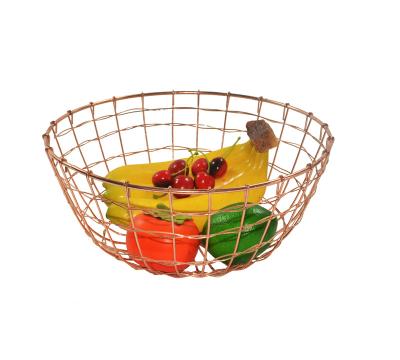 China Sustainable Household Rose Gold Metal Wire Fruit Basket Food Storage Basket for sale