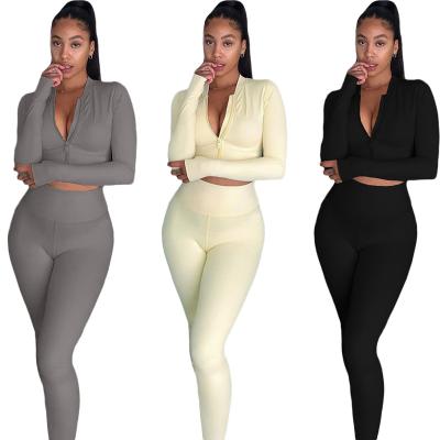 China Breathable 2023 European and American women's solid color zipper top sports slim two-piece set for sale