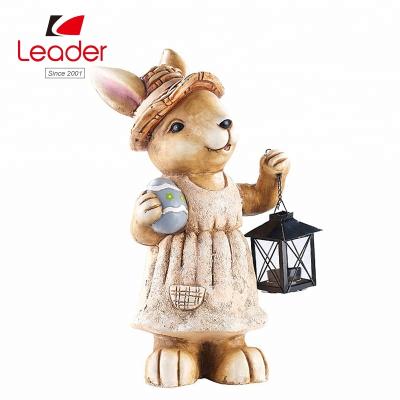 China Hot Selling China Polyresin Rabbit With Candle Lantern Easter Art Statue For Home And Outdoor Ornament for sale