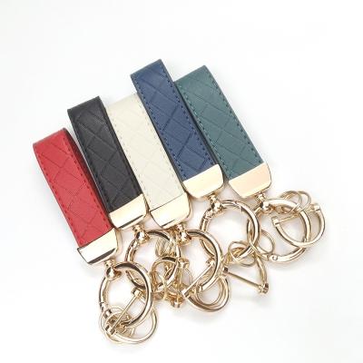 China Leather Fashion embossed diamond creative leather rope bag keychain for sale