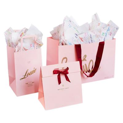 China Handmade Wholesale Pink Shopping Gift Bags Tote With Logo Ribbon for sale