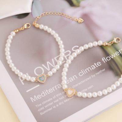 China FASHIONABLE Light Luxury Gold Plated 18k Diamond Heart Round Pearl Beads Bracelet For Women for sale