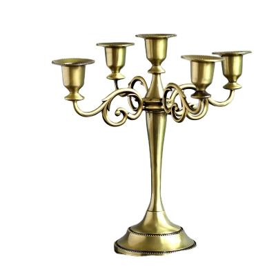 China Modern Art Unique Metal Candle Holder Black Gold Silver Bronze 5-Arm Retro Candelabra Stand Wedding Candlestick for sale