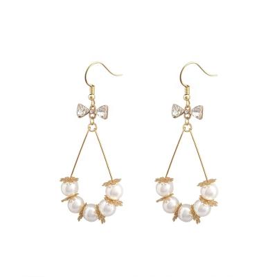 China New religious pearl crystal bow exaggerated long French femininity earrings for sale