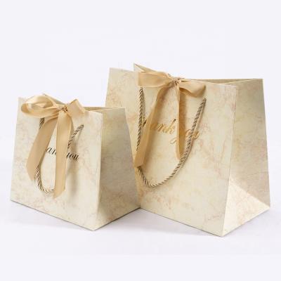 China Recyclable Christmas Gift Bags Kraft Paper Holiday Wrapping Paper Bags With Christmas Prints For Holiday Party Favors Christmas Gift Box Packaging for sale