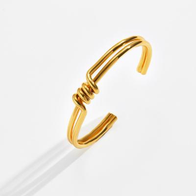 China Other Jewelry 18K Gold Plated French Brass Minimalist Open Irregular C Shape Spiral Bangle Design Bangle for sale