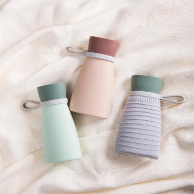 China Pinmoo Silica Gel Small Portable Hot Water Bottle Silicone Explosion Proof Microwave Heating Hand Warmer for sale