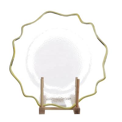 China Viable Popular Transparent Color Dinner Charger Dish Glass Serving Tray With Ruffle Gold Rim For Wedding Decoration for sale