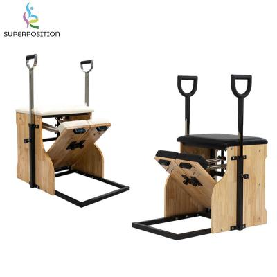 China Fitness center oak wood hot sale fitness studio yoga reformer stability pilates wunda chair for sale