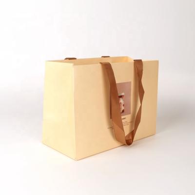 China Custom Printed Luxury Recycled Materials Carry Packaging Recycled Brown Kraft Paper Bags Gift Paper Shopping Bags For Retail Clothes for sale