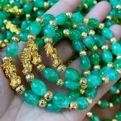 China TRENDY Synthetic Tough Lady Gold Pixiu Glass Bead Bracelet 3D Jade Bangle Oval Agate Beaded Jadeite Bracelet for sale