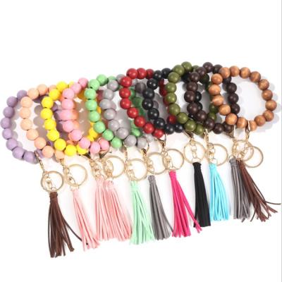 China CLASSIC European and American 2021 retro hot wooden beaded hook metal fashion bracelet main chain bracelet tassel bead round bracelet for sale