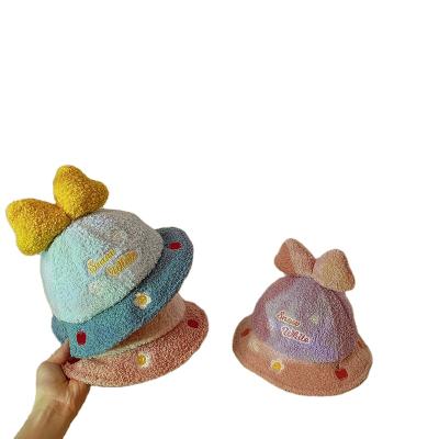 China Autumn and winter big bow girls' bucket hat warm hat of the same Korean character style children's hat and cute lined with baby fleece for sale