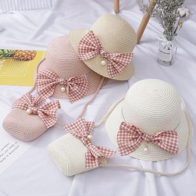 China Cool Trendy Kids Beach Hats With Bows And Decorations Summer White Pearl Summer Big Plaid Fabric Hot-selling Straw Hats Girls for sale