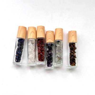 China New Product Of China Color Glass Essential Oil Bottle With Crystal Crushed Chip Stones For Natural Body Care for sale