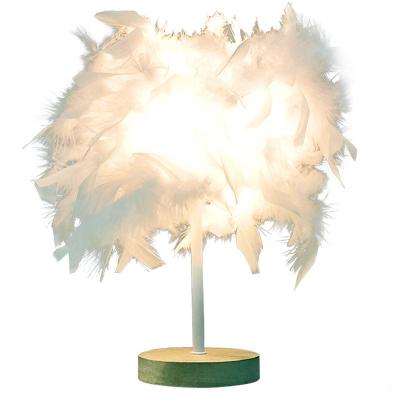 China Modern Warm Small Table Feather Wedding Room Central Institute of Statistics Girl Bedroom Bedside Creative Romantic Desk Lamp for sale