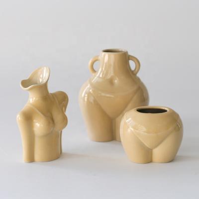 China Modern Handmade Beige Glazed Body Shape Ceramic Vase For Home Hotel Decor Centerpiece Gifts for sale