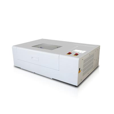 China Resure CNC CO2 100w High Speed ​​Laser Cutter / Laser Full-enclosed Engraving / Cutting Machine for sale