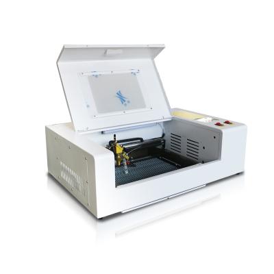 China Resure CNC CO2 100w High Speed ​​Laser Cutter / Laser Full-enclosed Engraving / Cutting Machine for sale