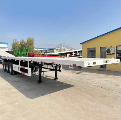 China 3 Axles Tri Axle Cargo Transportation Flatbed Container Chassis Semi Trailer In Sell for sale