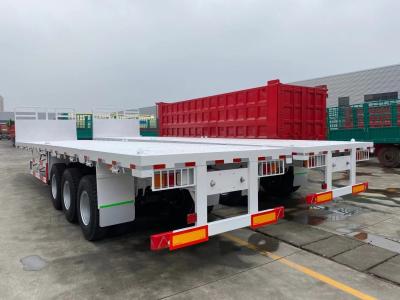 China Niet-zelfdumping 3-assige platte containertruck laagste halve aanhangwagen voor apparatuur Te koop