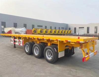 China No automotriz 3 ejes 40FT 50FT contenedor remolque de cama plana semirremolque de transporte en venta