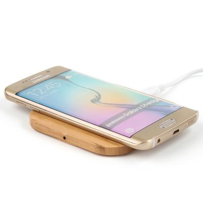 China Mini Phone 15w Qi Charging Wooden Station Bamboo Qi Wireless Power Bank Wireless Stand Holder for sale