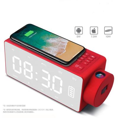 China 2022 Newest LED Digital Projection Audio Luminous Wireless Charging Alarm Clock Radio 2022 Multifunctional Wireless Clock Speaker for sale