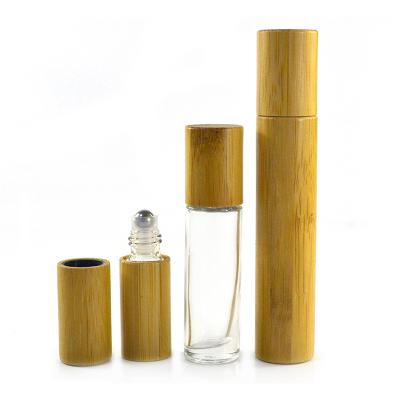 China Cosmetic Essential Oil Roller Luxury Bamboo Bottles 5ml 10ml 15ml Essential Oil Roller Glass Custom Matte Bottles With Wooden Lid for sale