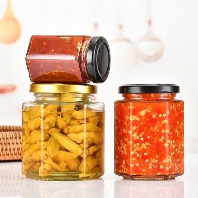 China Food Hot sale luxury hexagon glass honey jars with acrylic cap for sale