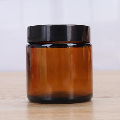 China Cosmetic Luxury 5g 10g 15g 20g 30g 50g Amber Glass Cream Jar With Black Plastic Lid for Face Cream for sale