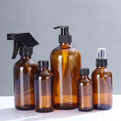 China Personal Care Big capacity 100ml 120ml 300ml 500ml amber glass bottle deluxe shampoo bottle pump for sale