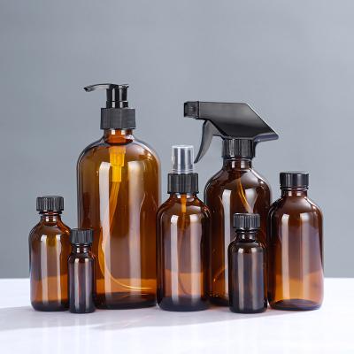 China Personal Care wholesale Refillable Fine Mist Sprayer Container clear Brown Glass Spray Bottles With Black Trigger for sale