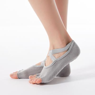 China Sporty Custom Logo Gray Solid Organic Cotton Anti Slip Knit 5 Half Toe Yoga Grip Socks for sale