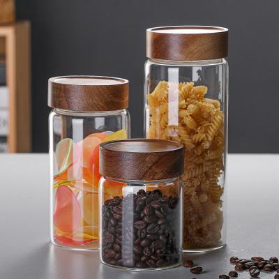 China Freshness Preservation Glass Storage Jar With Screws Wood Lid Small Glass Bottle Food Jar Box Cereal Canister Kitchen Storage Jars Container Organizer for sale