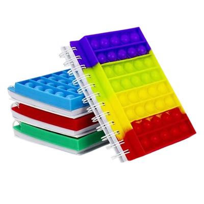 China Fashion silicone cover A5 finger fidgety person spiral Reliver stress push bubble pops toys spiral notebooks for sale