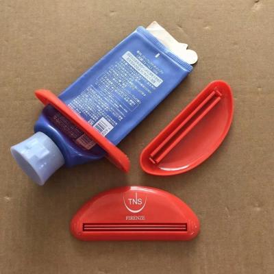 China Sustainable Plastic Push Save Tube Toothpaste Cream Squeezer With Brand Printed for sale