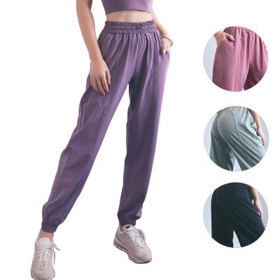 China Breathable Casual Solid Color Loose Street Wear Women High Waist Yoga Pants With Pockets Clothing Pants Gym for sale