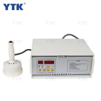 China Food Electromagnetic Induction Sealing Machine Portable Plastic Capsule Sealer for sale