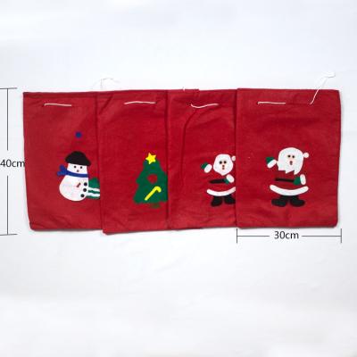 China Wholesale Cheap Nonwoven Fabric Santa Claus Drawstring Christmas Gift Bags For Christmas Decorations for sale